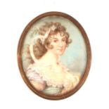 A 19th century portrait miniature on ivory depicting a young girl with a ribbon in her hair,