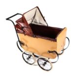 A restored Victorian pram or perambulator with leather hood and seat, cart springs and spoke wheels,