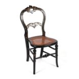 A Victorian ebonised balloon backed child's chair having mother of pearl inlay and gilt decoration
