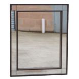 A modern design wall mirror, overall 80 by 99cms.