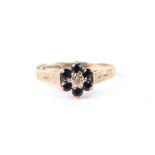 A 9ct gold sapphire and diamond cluster ring, approx UK size 'K', 1.3g.