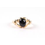 A 9ct gold and cabochon stone open claw set ring, approx UK size N, 2.9g.