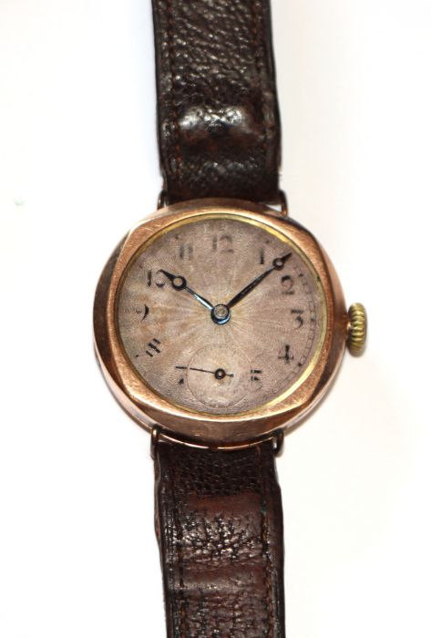 A 1920's Rolco 9ct gold tonneau shaped gentleman's wristwatch, having a silver dial with Arabic