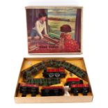 A Chad Valley clockwork tinplate train set containing locomotive and tender, 0-4-0, in LMS livery;