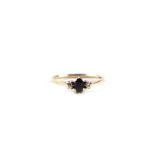 A 9ct gold sapphire and diamond three-stone ring, approx UK size 'N', 1.1g.