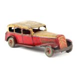 A Mettoy clockwork tinplate sedan car with Dunlop 90 printed wheels, 28cms long.