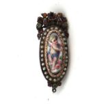 A Georgian white metal brooch with central portrait miniature depicting a cherub within a yellow