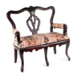 A miniature Georgian style double chair back doll's sofa with upholstered seat, 41cms wide.