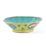 A Chinese yellow ground shallow bowl, 15cms diameter.