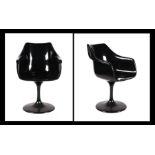 A pair of Charles & Ray Eames style shell chairs on swivel tulip bases (2).