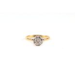 An 18ct gold and diamond cluster ring, approx UK size 'M', 3g.