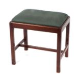 A Georgian style mahogany stool on square chamfered legs, with upholstered seat, 51cms wide.