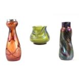 Three pieces of Art glass comprising a silver rimmed Loetz style vase, 17cms high; another