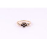 A 9ct gold diamond and sapphire ring, approx UK size 'K', 1.3g.