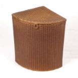 A Lloyd Loom Lusty floor standing corner linen basket, 50cms wide.