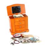 A quantity of costume jewellery in a modern three-drawer jewellery chest.