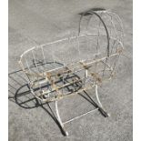 A 19th century painted ironwork crib (ideal for a garden planter), 97cms wide.