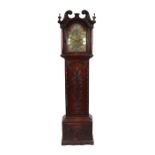 A 19th century longcase clock, the arched brass dial with silvered chapter ring and Roman