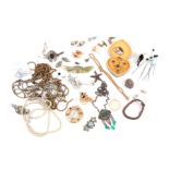 A quantity of assorted costume jewellery to include brooches, hat pins, necklaces and similar