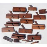A group of woodworking moulding planes.