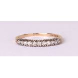 A 9ct gold white stone set half eternity ring, approx UK size 'Q', 1.4g.