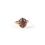 A 9ct gold and smoky quartz solitaire ring, approx UK size 'L', 2.1g.