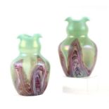 A pair of Art glass vases of waisted form with crimped rims and dimpled sides, 20cms high (2).