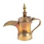 A Turkish / Islamic brass dallah coffee pot, 22cms high.