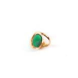 A gentleman's 22ct gold (stamped) green cabochon stone signet ring, approx UK size 'D', 3.7g.