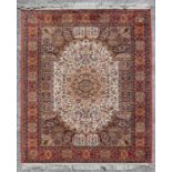 A modern silk effect rug, the central medallion within a multi floral border, 170 by 123cms.