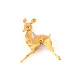 An Italian 18ct gold brooch modelled as a deer with ruby eyes, 9g.