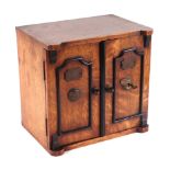 A late Victorian / early Edwardian oak table to safe box, having twin doors opening to reveal
