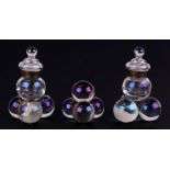 A pair of Victorian iridescent glass inkwells in the form of a stack of cannon balls; together