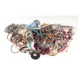A quantity of costume jewellery to include necklaces and bracelets.