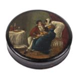 An early 19th century papier-mâché snuff box of compressed circular form, the top decorated with a