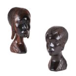 An African carved hardwood bust of a lady, 19cm high; together with another similar 17cm high (2).