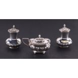 A late Victorian silver three piece cruet set, 150g.