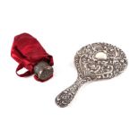 An Edwardian silver backed hand mirror, Birmingham 1904; together with a white metal mounted silk