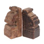 A pair of hardwood Indo-Persian bookends fashioned from pillar capitals, each 25cm high (2)
