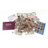 A quantity of mixed loose coinage and bank notes to include one pound notes.