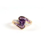 A 9ct gold amethyst and diamond crossover ring with central heart shaped stone, approx UK size '