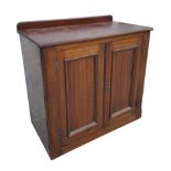 A Victorian mahogany two door cupboard with shelved interior. 103cm wide