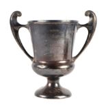 An Edwardian Wellington College two-handled silver trophy cup, London 1908, 646g, 21cm high.