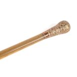 A 19th century rhino horn swagger stick / short walking cane with gold plated handle. 76 cm long