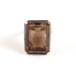 A 9ct gold and emerald cut smoky quartz dress ring, approx UK size 'J', 9g.