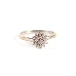 A 9ct white gold and diamond flower head cluster ring, approx UK size 'L', 2g.