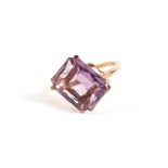 A 9ct gold and emerald cut amethyst solitaire ring, approx UK size 'P', 5g.