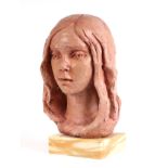 Fiore de Henriquez (Italian 1921-2004) - a clay bust of a young woman, mounted on a figured marble