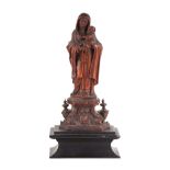 An 18th century carved boxwood figural group of the Madonna and child, mounted on a base, 16cm high.
