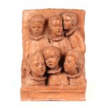 Fiore de Henriquez (Italian 1921-2004) - a clay wall plaque depicting a group of choir boys,